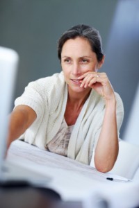 Middle aged woman at computer